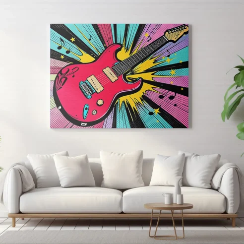 Tableau pop art guitare rouge suspendu au-dessus d’un canapé blanc dans un intérieur contemporain.